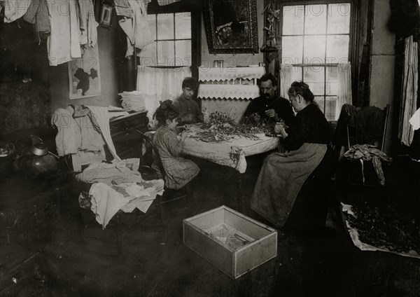 Julian, a six-year-old child, making pansies for her neighbors on top floor 1912