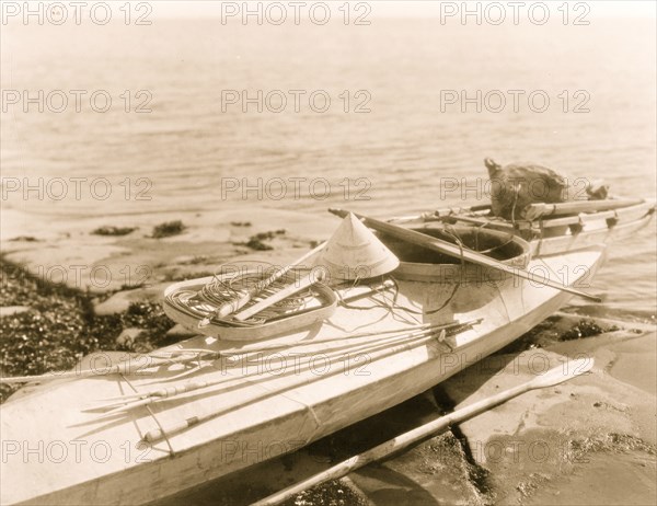 Kayak with seal hunting equipment, Nunivak 1929