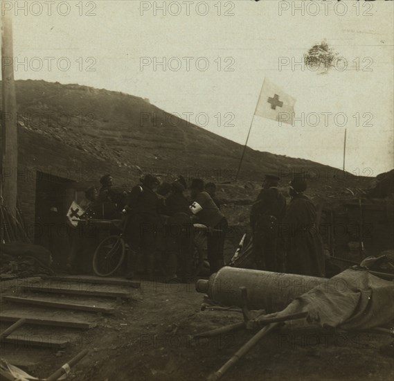 Lifting a wounded Russian to a bicycle stretcher 1905