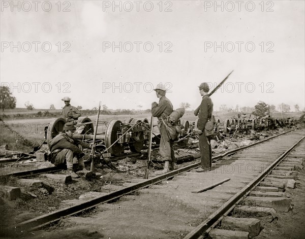 Manassas Junction, Va. Soldiers beside damaged rolling stock of the Orange & Alexandria Railroad 1862