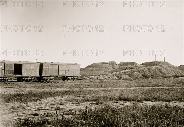 Manassas, Virginia. Confederate fortifications. (U.S. Military Railroad boxcars on left.) Orange & Alexandria Railroad 1862