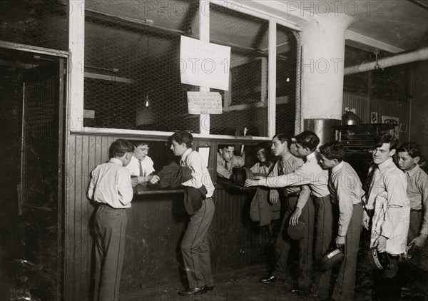 Messengers at the main office, Postal Telegraph Co., 283 Broadway, turning in their uniforms at close of the day. The boys are carefully supervised and clothes are well kept.  1910