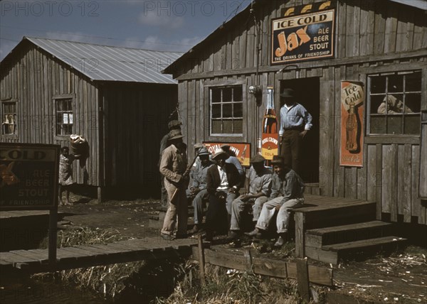 Migratory Workers outside a "juke joint" for migratory workers, a slack season; Belle Glade, Fla. 1941