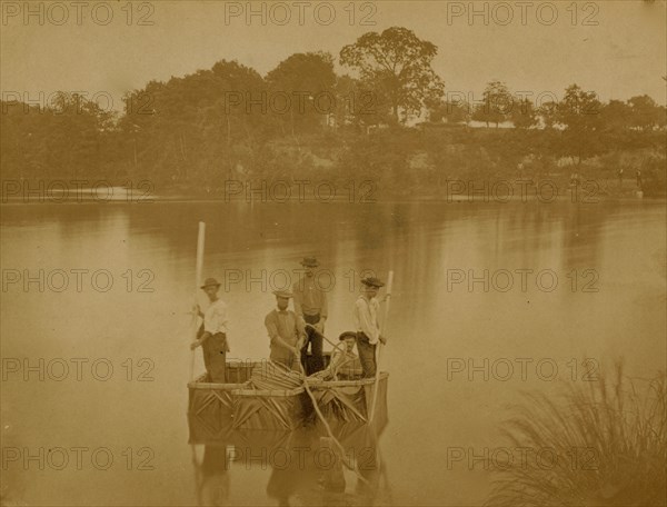 Military construction in northern Virginia: five men in three blanket boats strapped together on the Potomac River 1863