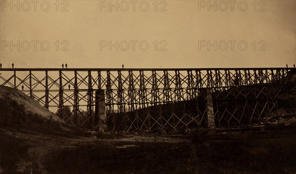 Military railroad bridge over Potomac Creek on the Richmond, Fredericksburg & Potomac Railroad, built by the U.S.M.R.R. Construction Corps, C.F. Nagle, supervisor / photographed by Capt. A.J. Russell, chief of Photographic Corps, U.S.M.R.R. 1864