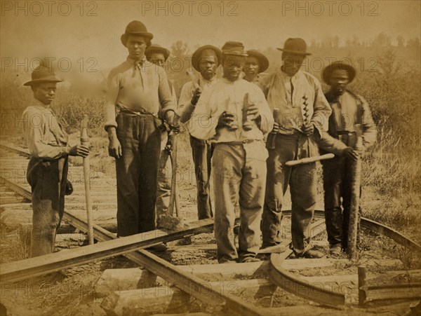 Military railroad operations in northern Virginia: men standing on railroad track 1863