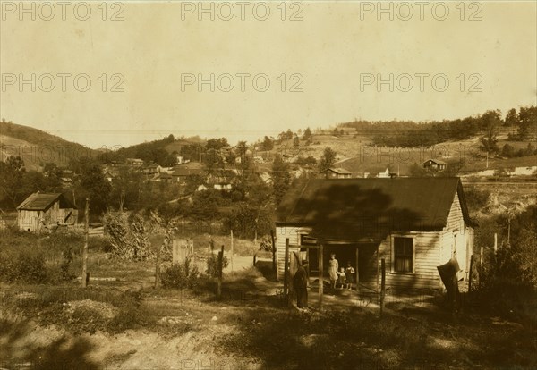 Miners cabins on the Elk River at Bream, W. Va. near Charleston. Others on slope beyond. A typical mining community here. Children go to Big Chimney school. Oct. 10, 1921. Location: Bream, West Virginia 1913