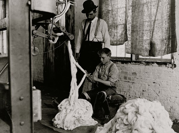 Boy at warping machine. 1908