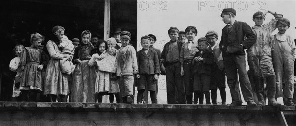 Oyster shuckers and baby tenders at Pass Packing Co. All worked from before daybreak until 5 P.M. 1911