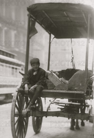 Package help sits on rear of Delivery Wagon 1910