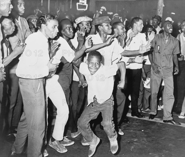 Part of crowd in Harlem chants and taunts police on Lenox Ave 1964