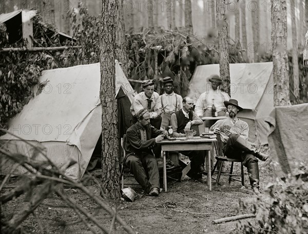 Petersburg, Va. Officers of the 114th Pennsylvania Infantry playing cards in front of tents 1864