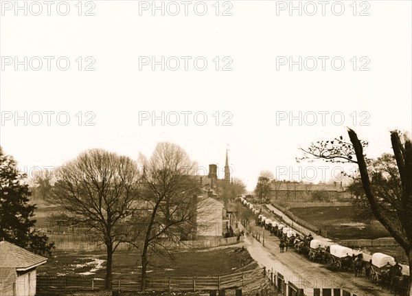 Petersburg, Virginia. The first Federal wagon train entering the town 1864