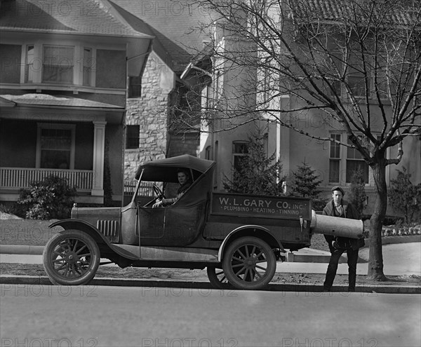 Plumbing & Heating Contractors Unload a Boiler 1926