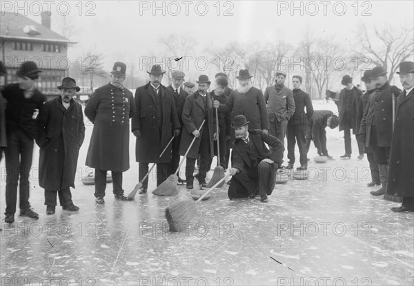 Curling in Central Park with Men having Brooms at the ready over the ice.