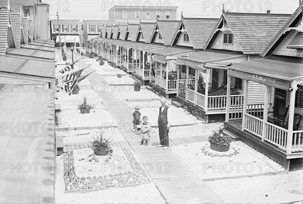 Porches and front lawns of row of bungalows, Rockaway, N.Y.