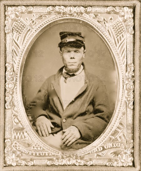 Seated soldier wearing four button sack with kepi, patriotic matte 1865