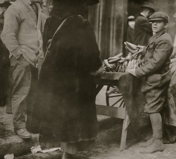 Selling bananas at market.  1917