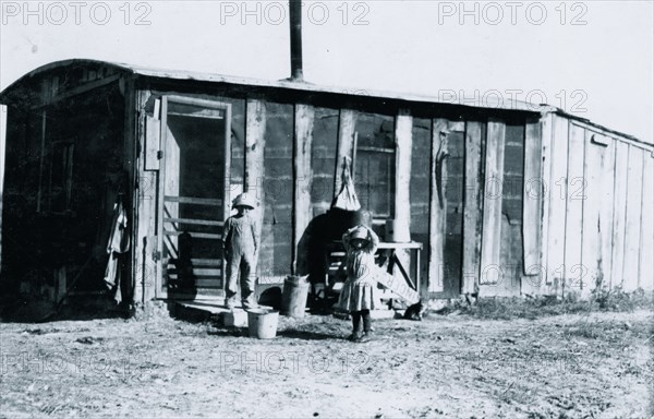 Shack in which the Reibers live, 10 x 15 ft. with a small shed attached 1915