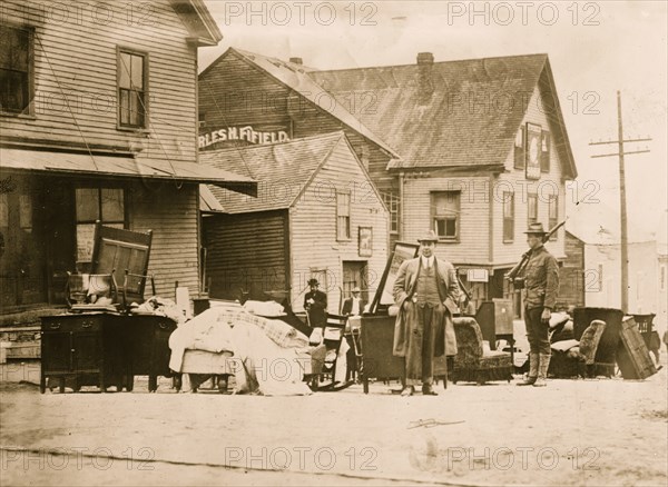 Soldier guarding household effects, Bangor fire 1912