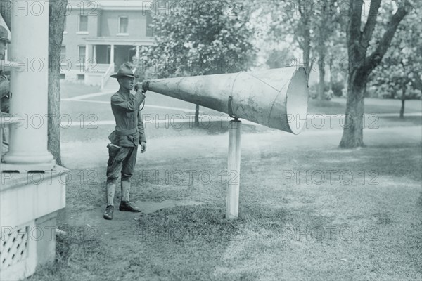 Soldier Plays his bugle into a huge megaphone at Fort Totten, Bayside Queens New York