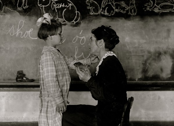 Teaching a deaf-mute to talk. Training School for Deaf Mutes. 1917