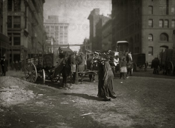 The breaking point. A heavy load of garnets for an old woman. 1912