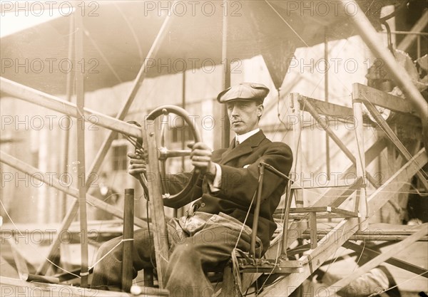 Dr. Wm. Greene at pilot wheel of aeroplane 1909