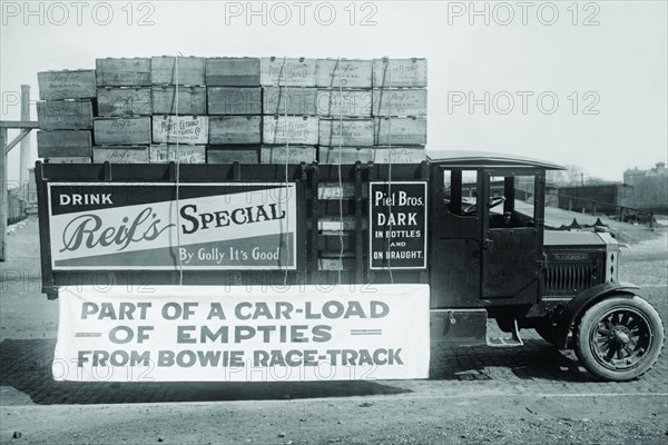 Truck load of empty bottles in boxes from racetrack