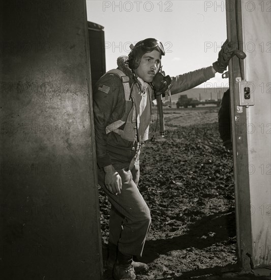 Portrait of Tuskegee airman Edward M. Thomas, standing 1945