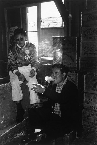 Two young men in co-op goods store 1943