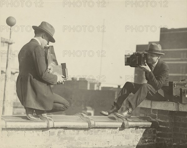 High Up Cameramen Shoot Each other