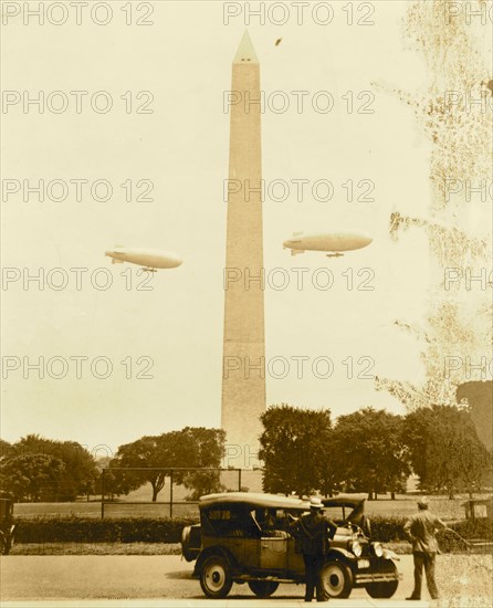 U.S. Army blimps, the T.C. 5 and T.C. 9 from Langley Field, Va. passing over the Washington Monument during a practice flight 1922