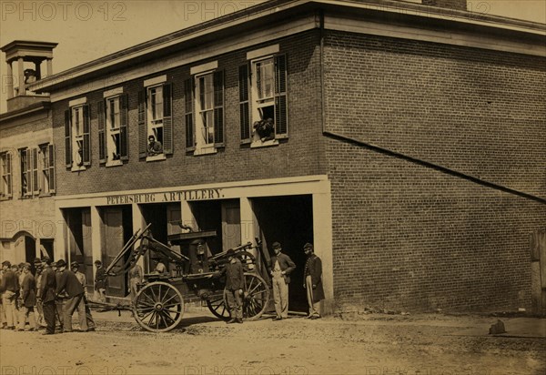 Union soldiers pull a fire engine from a garage designated Petersburg artillery 1863