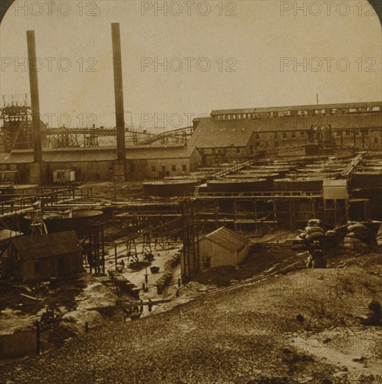 View over Village Deep Gold Mine, showing battery, tanks and shafts 1915