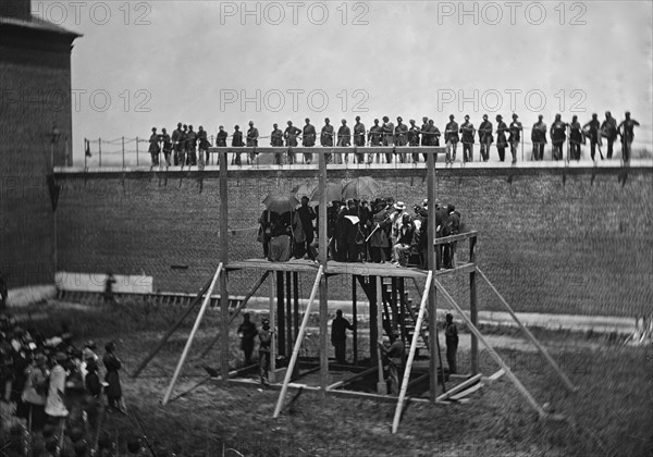 Washington, D.C. Gen. John F. Hartranft reading the death warrant to the conspirators on the scaffold 1865