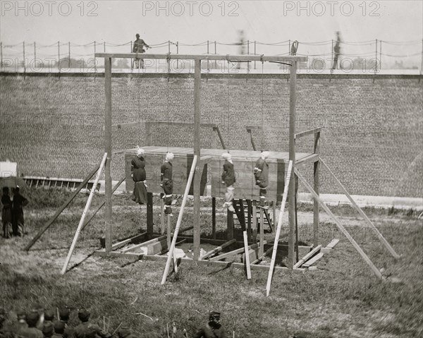 Washington, D.C. Hanging bodies of the conspirators; guards only in yard 1865