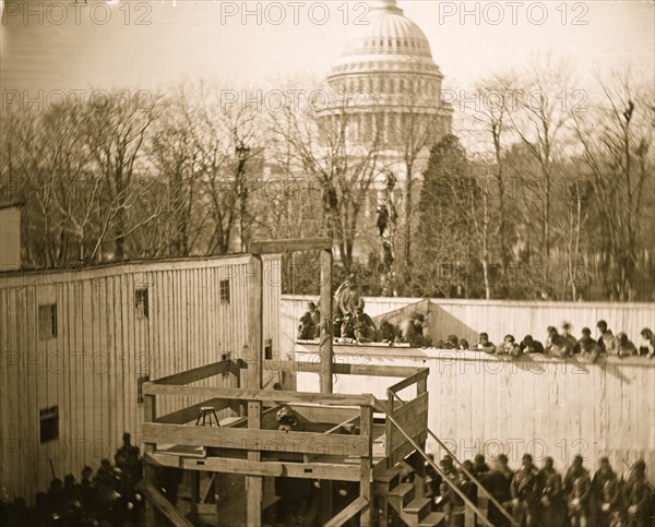 Washington, D.C. Hooded body of Captain Wirz hanging from the scaffold 1865