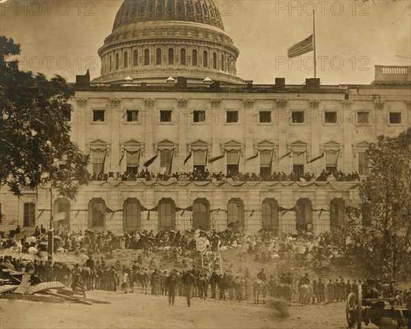 Washington, D.C. Spectators at side of the Capitol, which is hung with crepe and has flag at half-mast during the "grand review" of the Union Army 1865