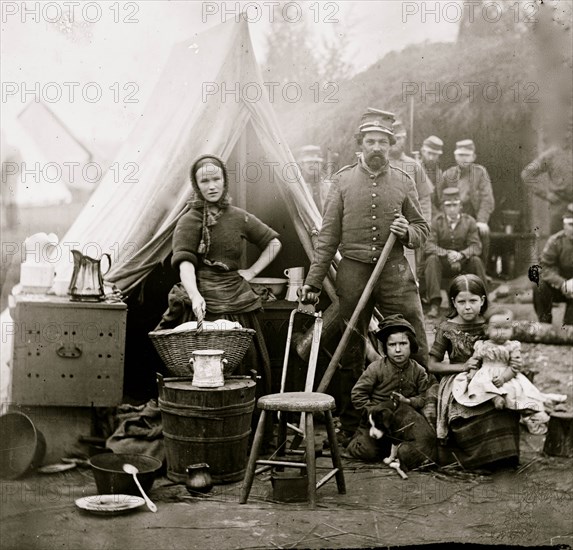 Washington, District of Columbia. Tent life of the 31st Penn. Inf. (later, 82d Penn. Inf.) at Queen's farm, vicinity of Fort Slocum; husband and wife with Children and a baby; wife does wash 1861