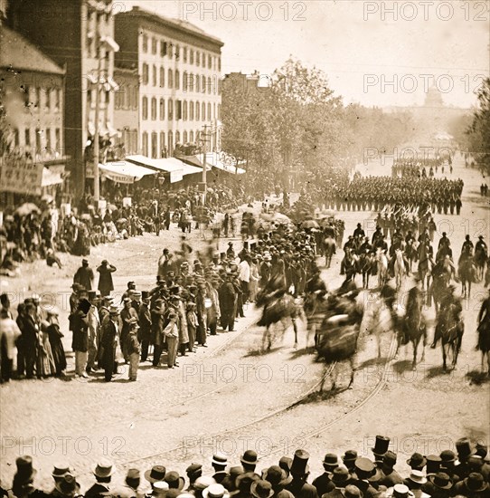 Washington, District of Columbia. The Grand Review of the Army. Gen. Henry W. Slocum (Army of Georgia) and staff passing on Pennsylvania Avenue near the Treasury 1865