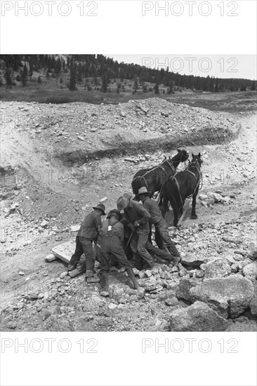 Loading boulder on stone boat 1936