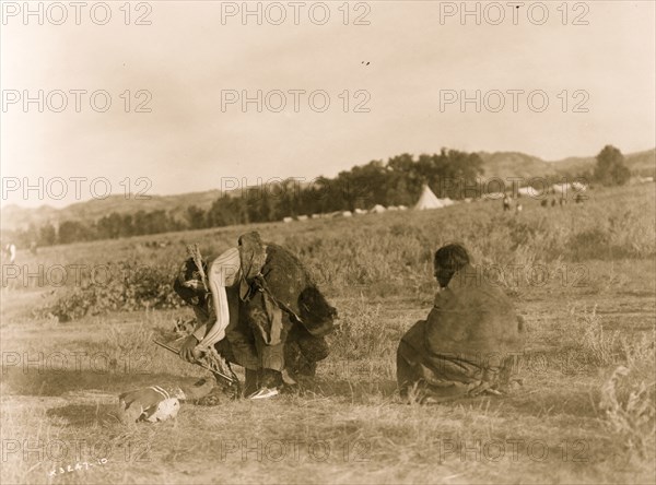 Offering pipe to the skull--Cheyenne 1910