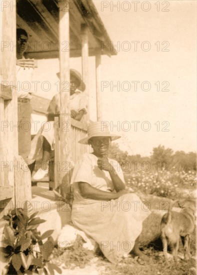 Women posing on a porch, Cat Island, Bahamas 1935