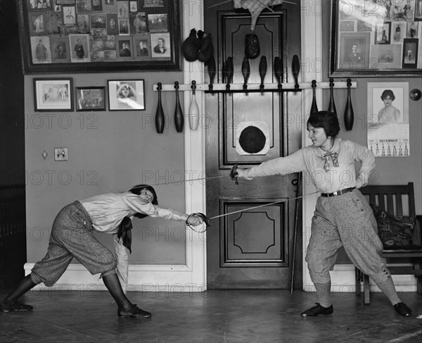 Women's Fencing in Gym as posed without Protection