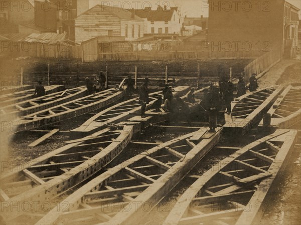 Yard at Alexandria, construction corps finishing portable bridge trusses 1863