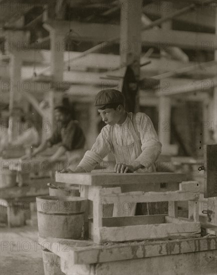 Young boy polishing marble in Vermont Marble Co., 1910