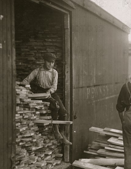 Young boy working for Hickok Lumber Co. Location: Burlington, Vermont. 1910