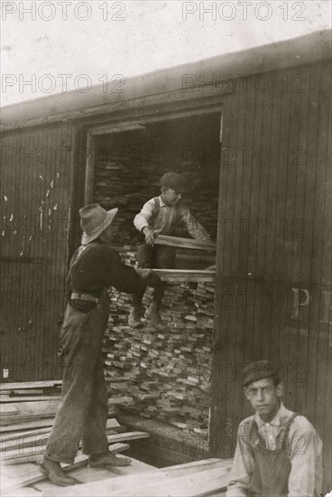 Young boy working for Hickok Lumber Co. Location: Burlington, Vermont. 1910