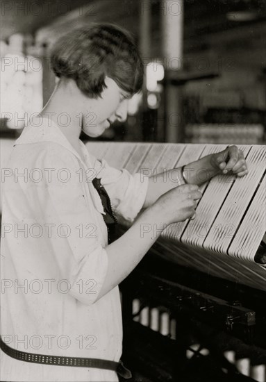 Young Girl woks on silk thread machine 1924